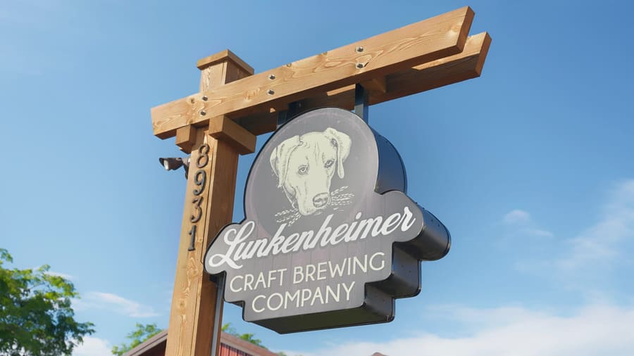Lunkenheimer Craft Brewing Company sign hanging from a wooden post